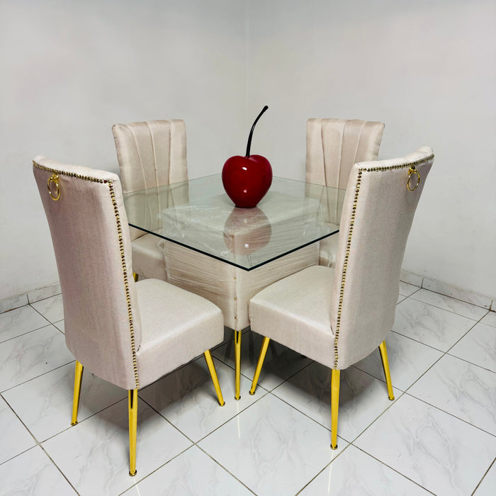 Comedor tapizado beige 4 silla pata de metal tope de cristal